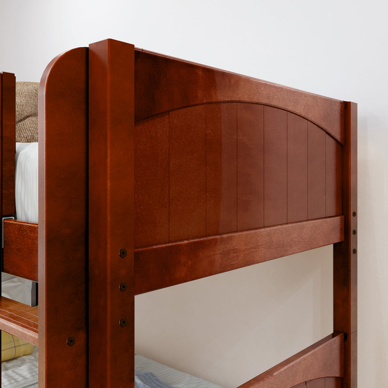 Wooden bunk bed with rich finish in a cozy bedroom setting.