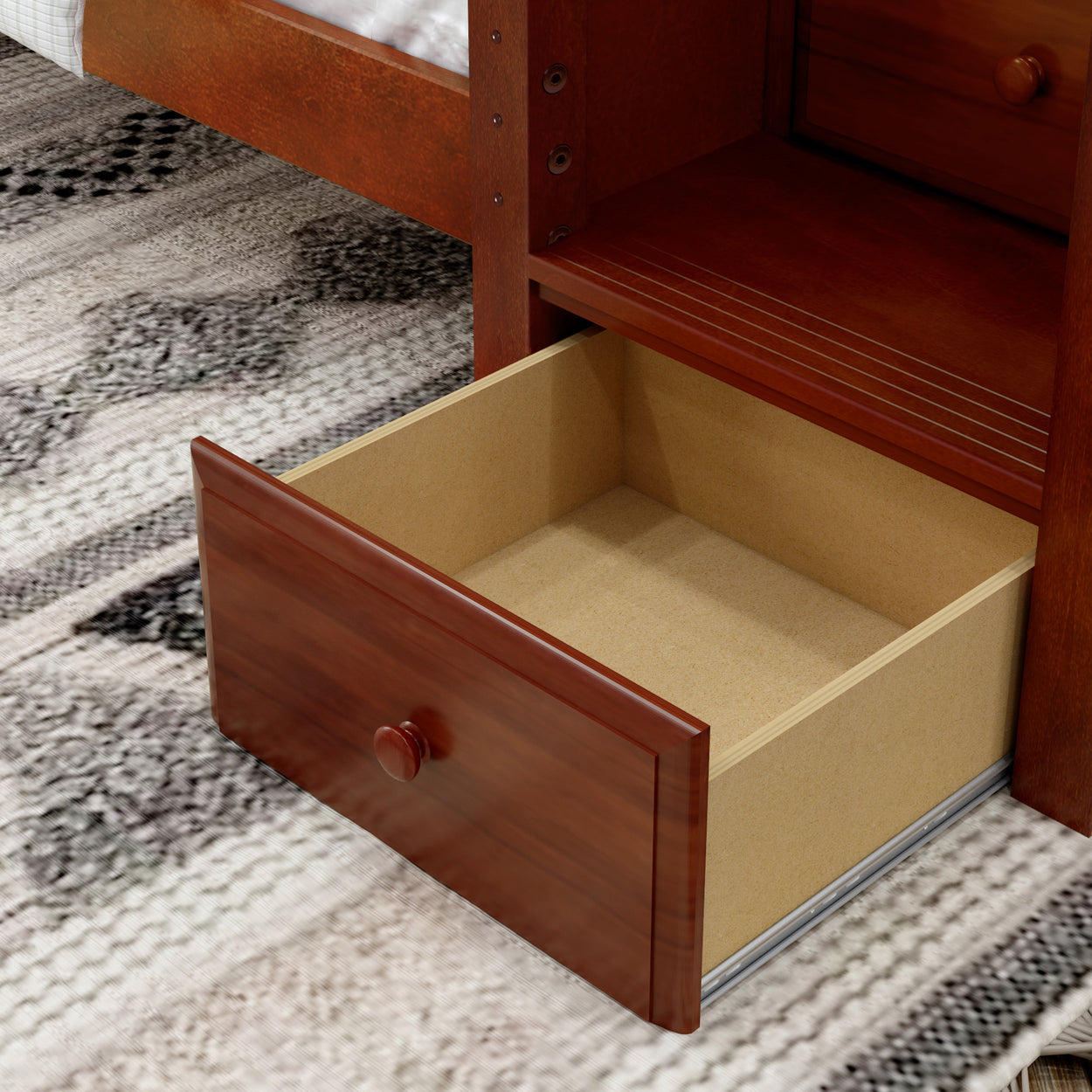Open wooden drawer in a modern bed frame showcasing additional bedroom storage solutions.