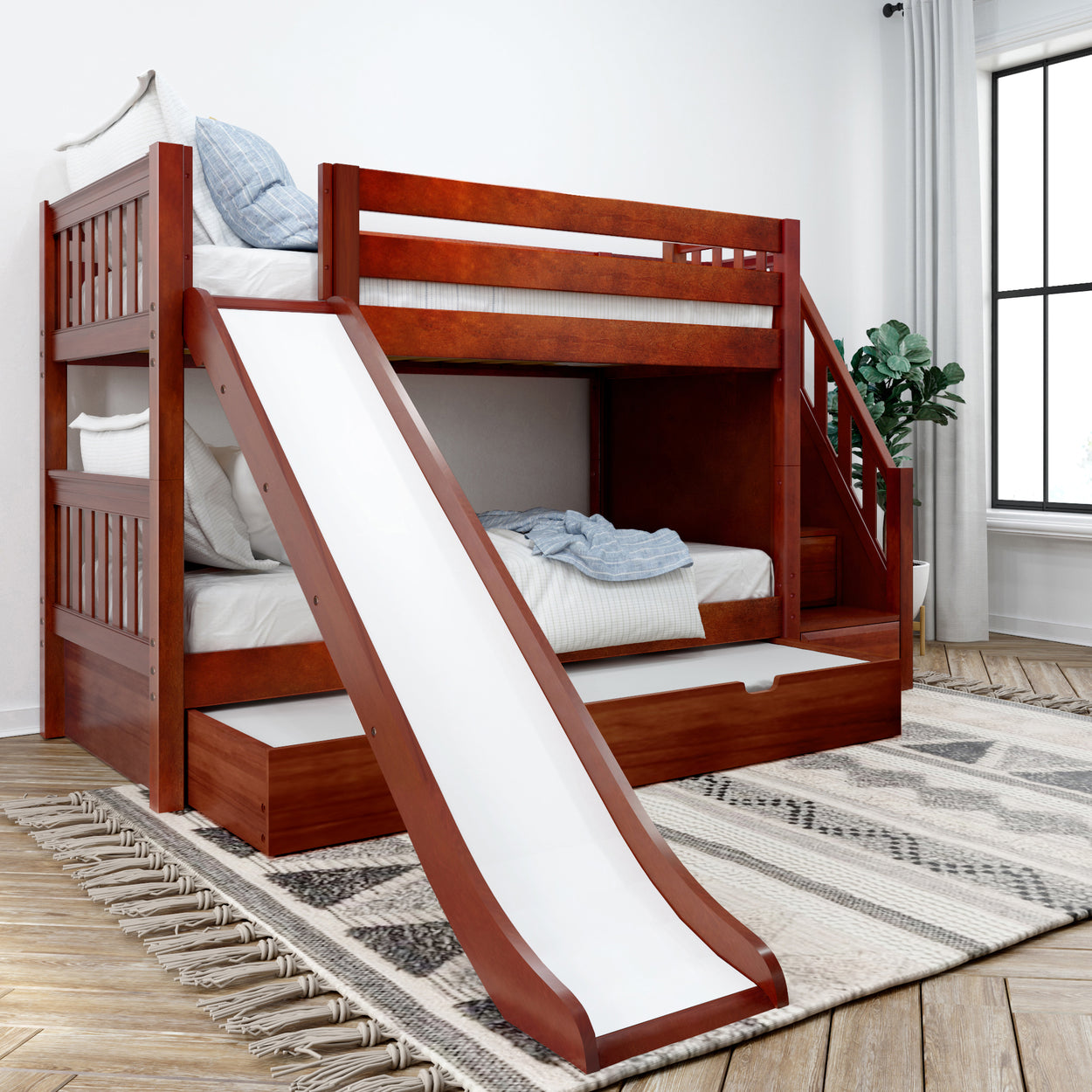 Wooden bunk bed with slide in modern bedroom setting, featuring storage drawers and cozy bedding.