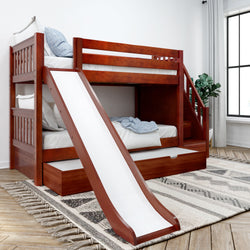 Wooden bunk bed with slide in modern bedroom setting, featuring storage drawers and cozy bedding.