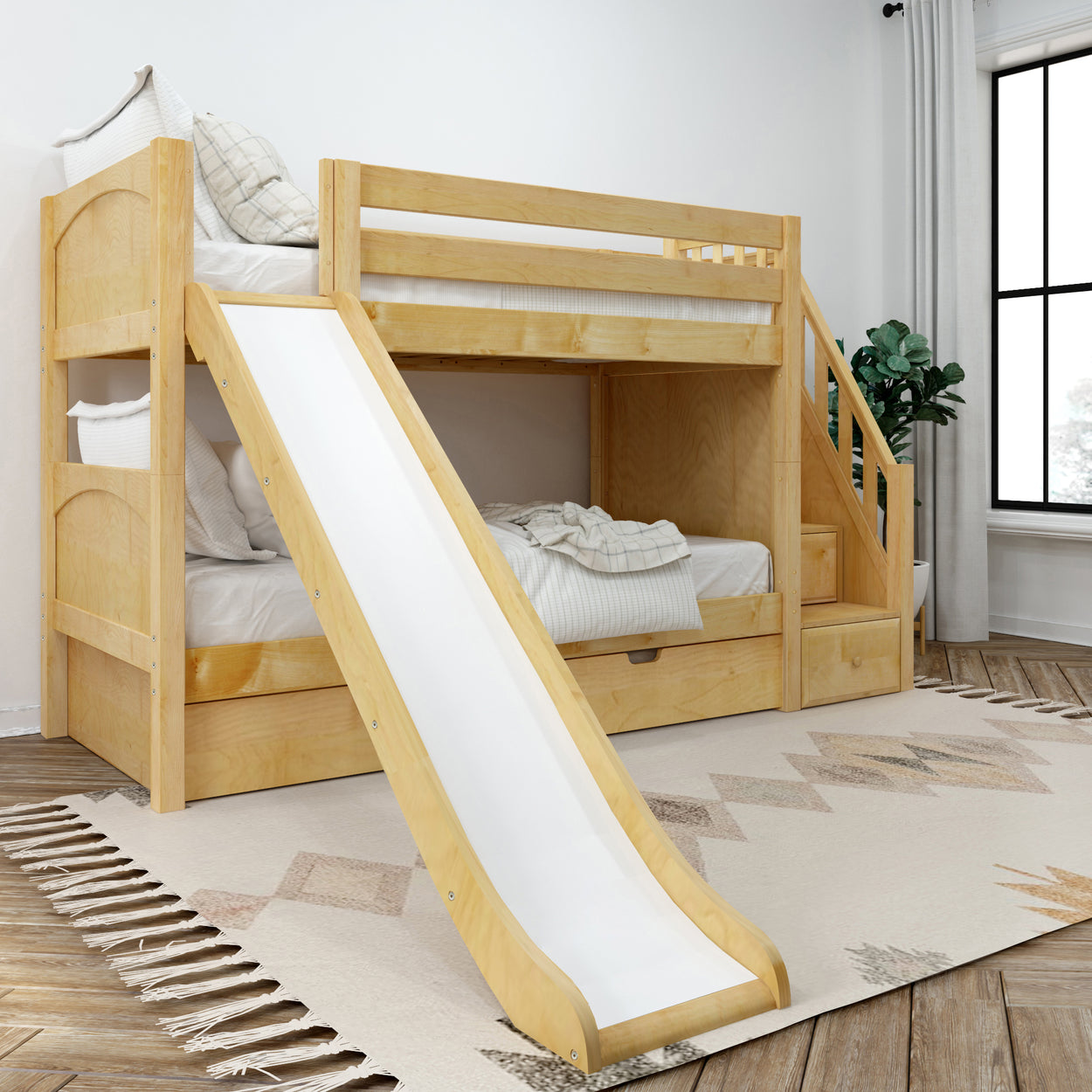 Kids' wooden bunk bed with slide and stairs in a modern bedroom.