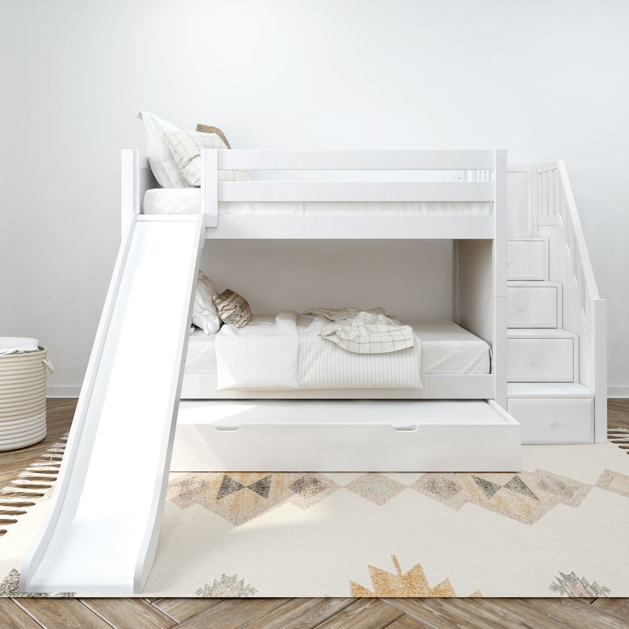 White bunk bed with slide, stairs, and storage drawers in modern kids bedroom decor.