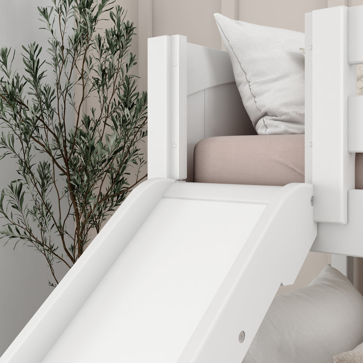 White wooden children's loft bed with slide, featuring soft pink bedding and a decorative plant in a cozy bedroom.