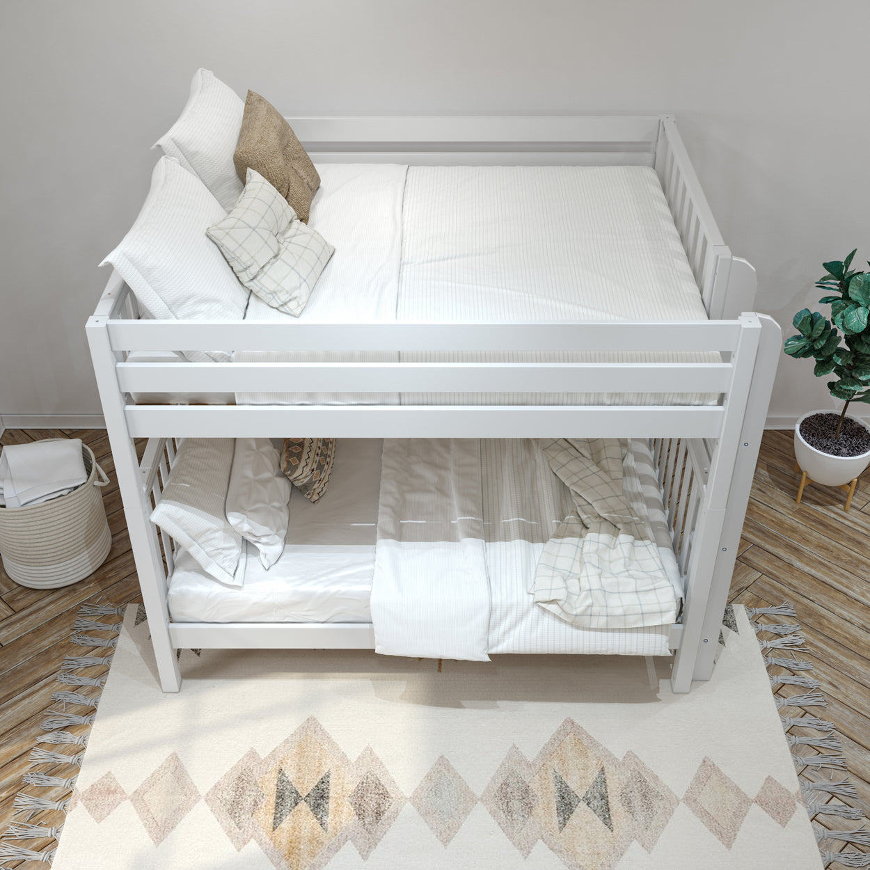 White bunk bed with comfortable pillows and a cozy rug in a modern bedroom setting.