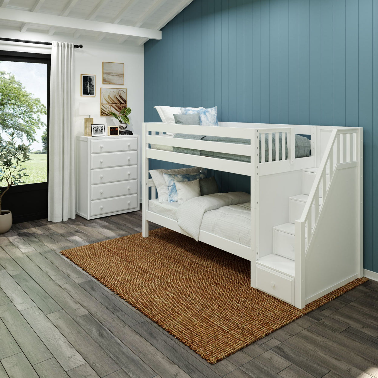 White bunk bed with staircase in modern bedroom with blue accent wall and hardwood floor.