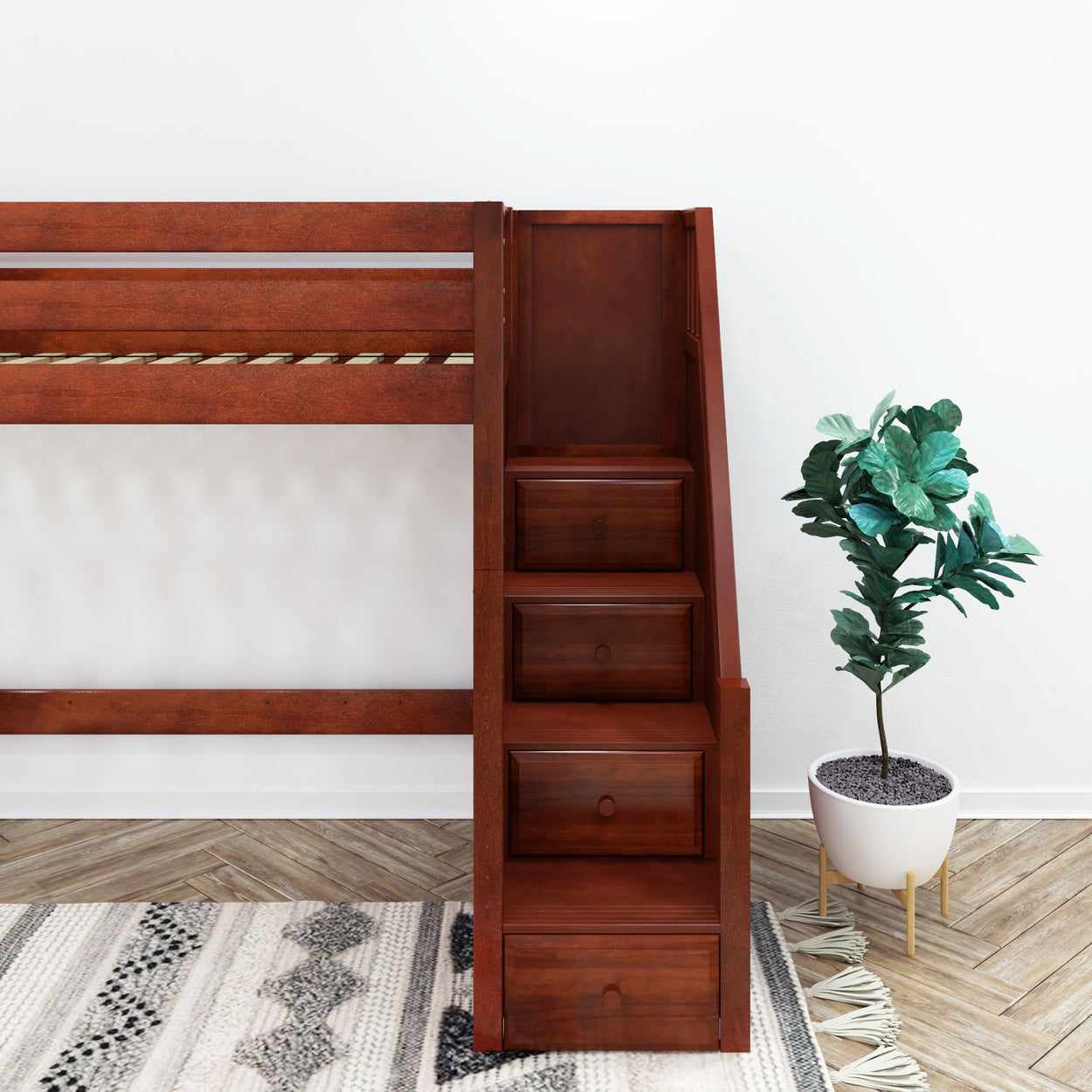 Mahogany loft bed with stairs and storage drawers next to a potted plant on a patterned rug.