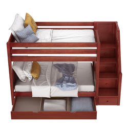Wooden bunk bed with storage stairs and pillows in a modern bedroom.