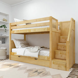 Wooden bunk bed with staircase and storage in modern bedroom setting.