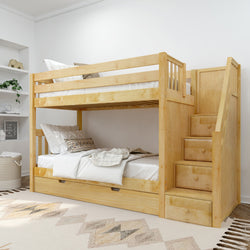Wooden bunk bed with built-in storage stairs in a cozy bedroom setting.