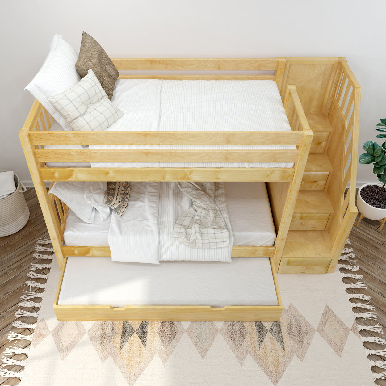 Wooden bunk bed with integrated stairs and pull-out trundle in a cozy bedroom setting.