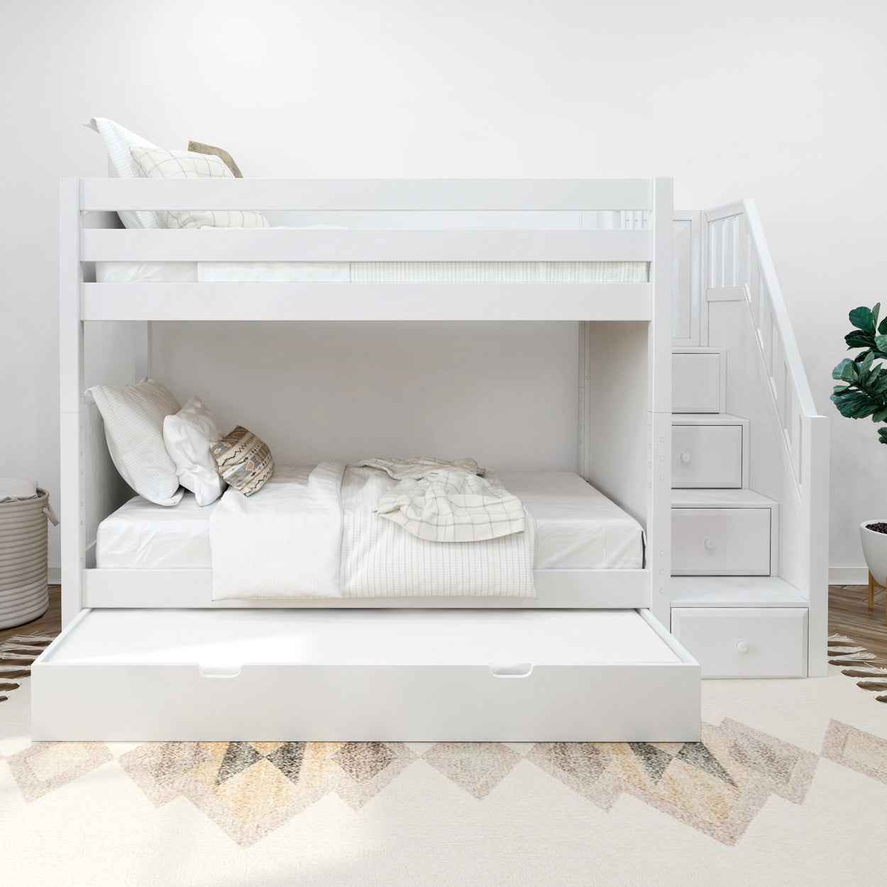 White wooden bunk bed with built-in storage stairs and trundle bed in modern bedroom.