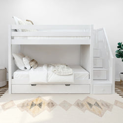White wooden bunk bed with stairs and storage drawers in a modern bedroom setting.