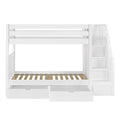 White wooden bunk bed with built-in staircase and storage drawers for kids' bedroom.