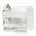 White bunk bed with staircase storage and cozy bedding featuring pillows and blankets in a bright bedroom.