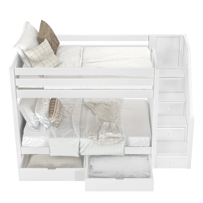 White bunk bed with staircase storage and cozy bedding featuring pillows and blankets in a bright bedroom.