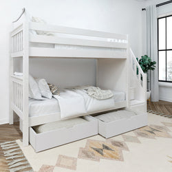 White wooden bunk bed with built-in stairs and storage drawers in a modern bedroom setting.