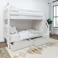 White wooden bunk bed with storage drawers in a modern bedroom with a geometric patterned rug.