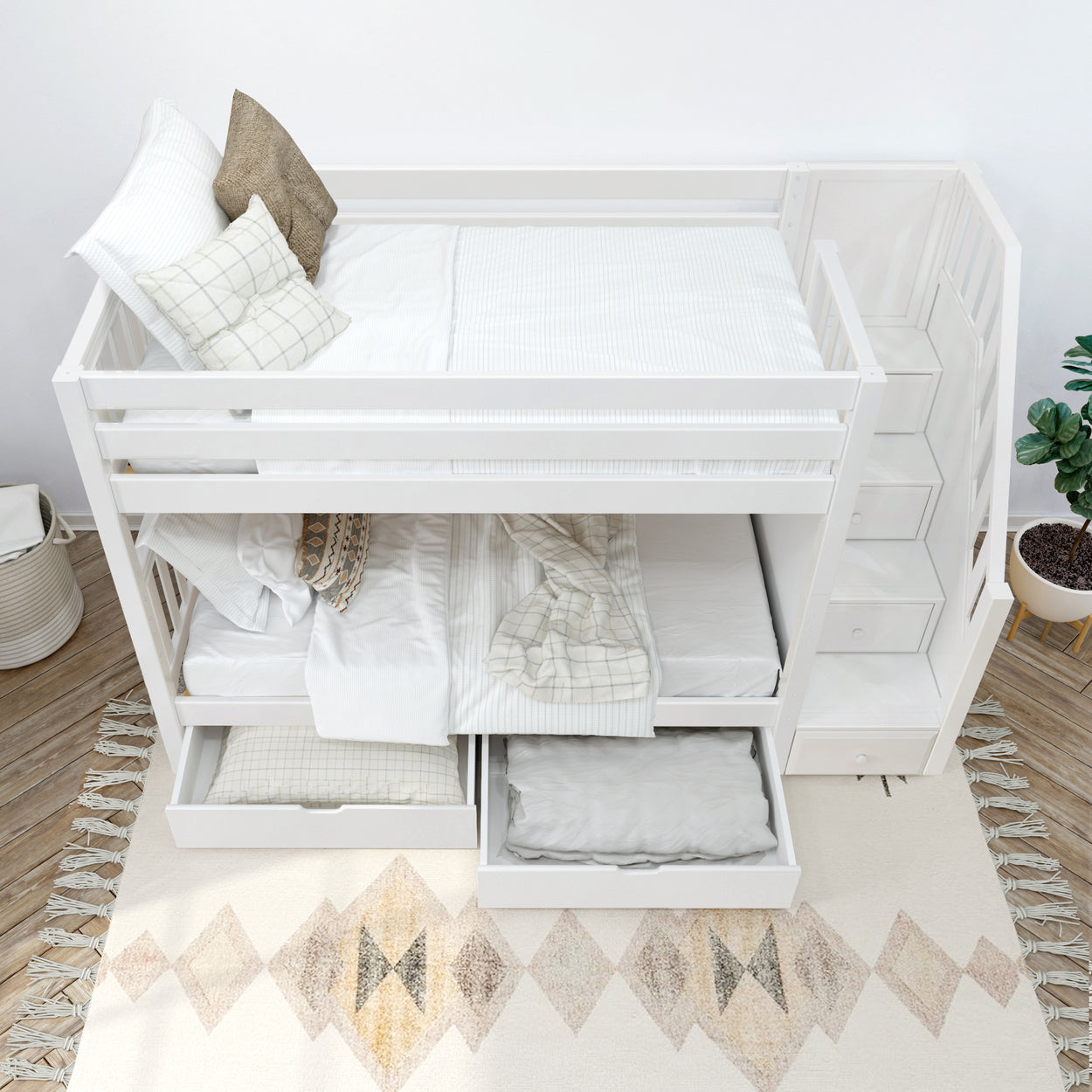 White wooden bunk bed with built-in staircase and under-bed storage drawers in modern bedroom.
