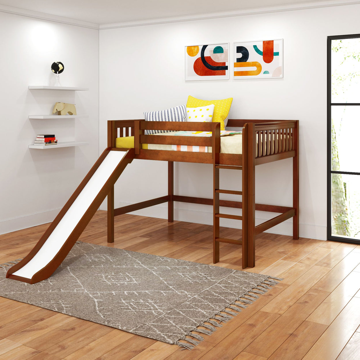 Children's wooden loft bed with slide in a modern bedroom setting featuring colorful pillows and wall art.
