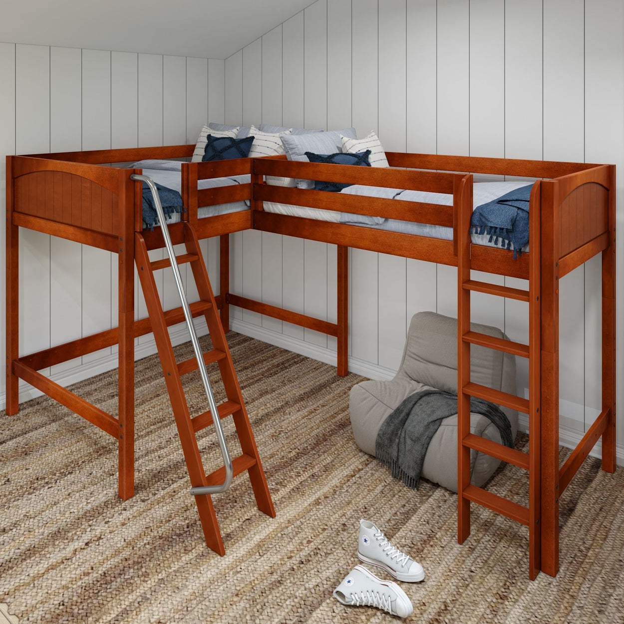 Child's wooden loft bed with attached ladder in a cozy bedroom with striped rug and bean bag chair.