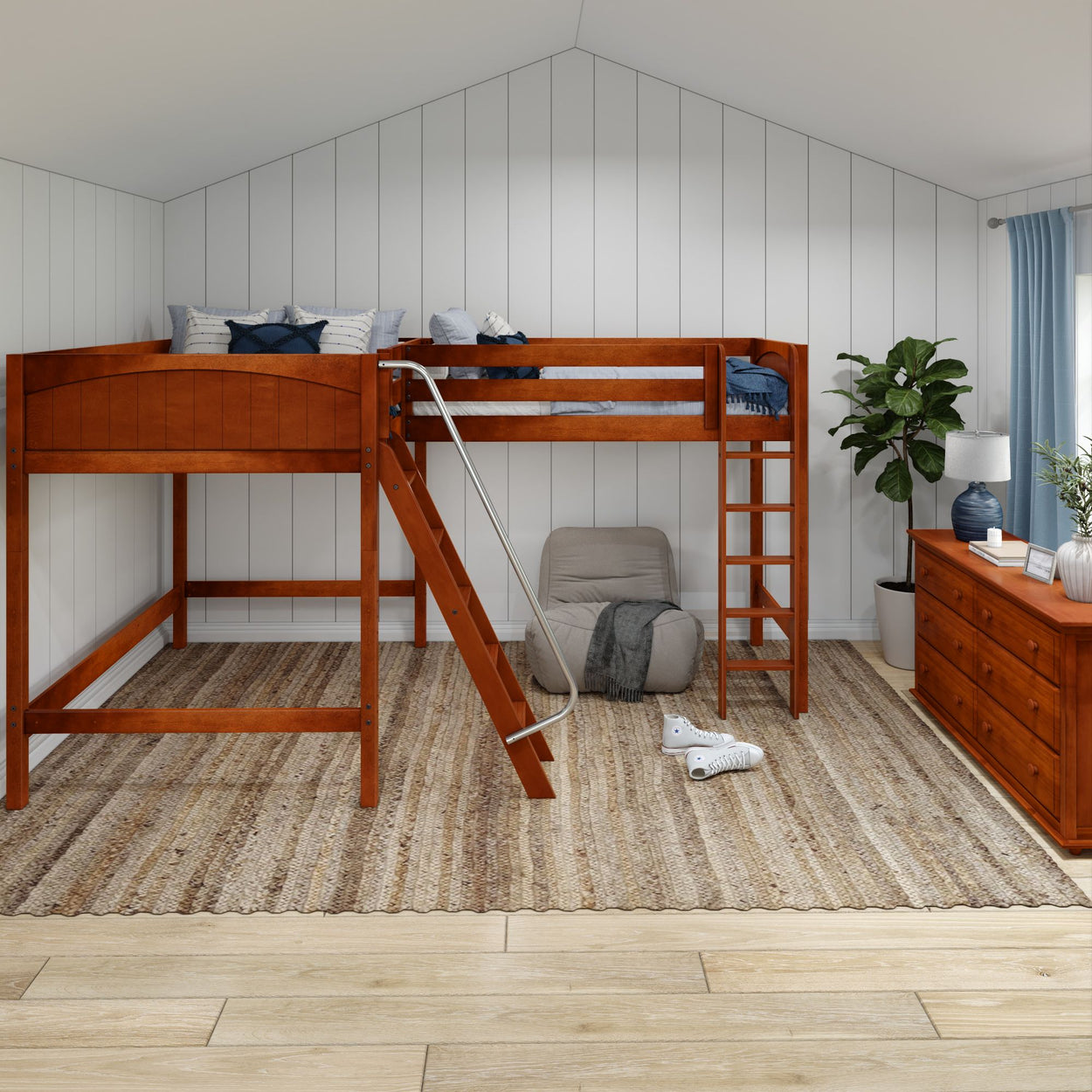Loft bed with wooden frame and ladder in modern bedroom featuring a cozy rug, armchair, and potted plant.