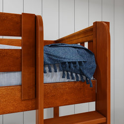 Wooden bunk bed with blue woven blanket in cozy bedroom setting.