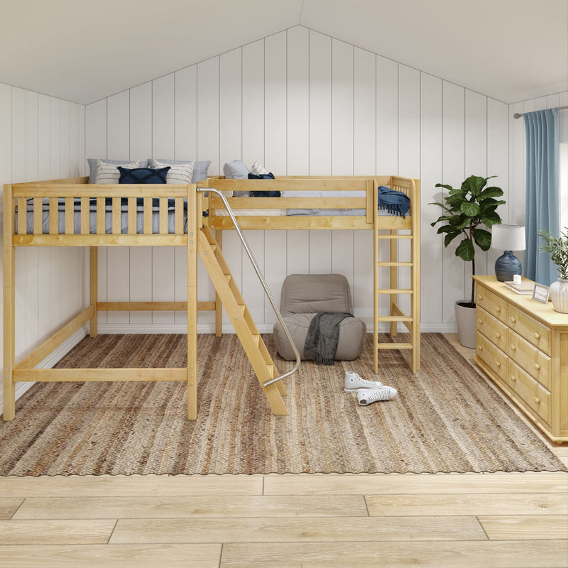 Light wood loft bunk bed with slide and ladder in coastal farmhouse kids' bedroom, white vertical shiplap walls, blue bedding, woven rug, wooden dresser and potted plant