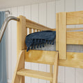 Wooden bunk bed ladder in natural pine with chrome safety handrail and navy blue throw against white shiplap wall