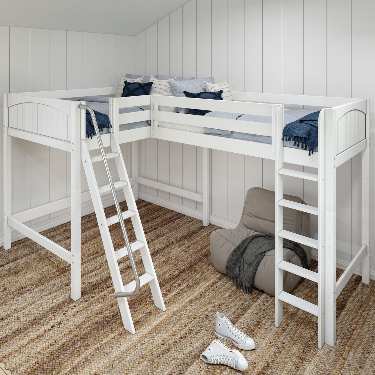 White wooden loft bunk bed with ladder in a cozy bedroom featuring a beige armchair and brown carpet flooring.