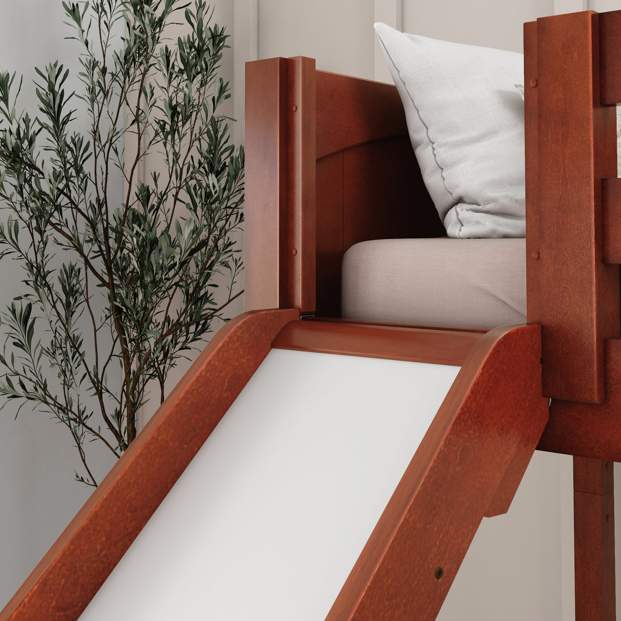 Modern wooden loft bed with slide in cozy bedroom setting.