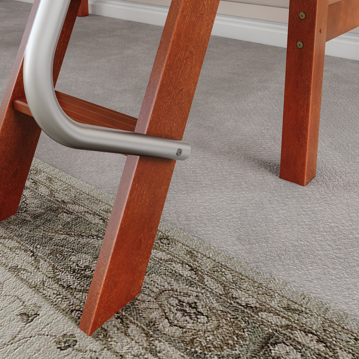 Wooden ladder leg with metal support on carpeted floor and patterned rug.