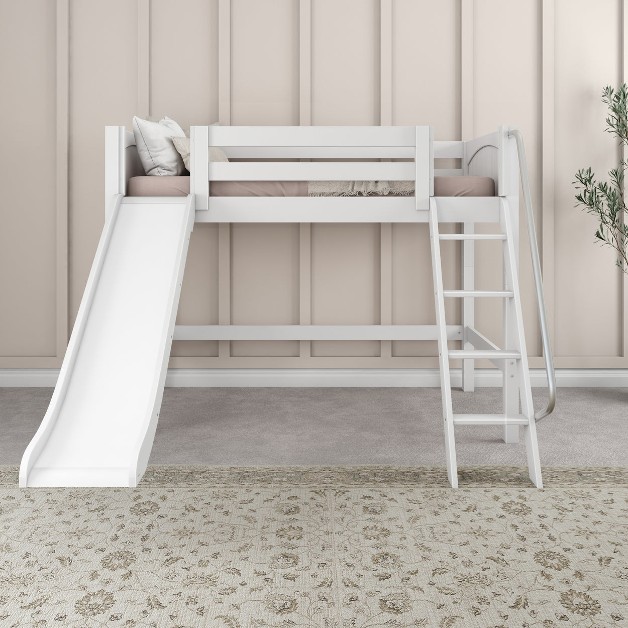 White kids' loft bed with slide and ladder in a cozy, modern bedroom setting with light beige walls and patterned rug.