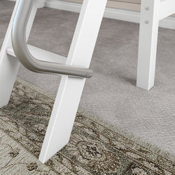 White modern home ladder on carpet with detailed design rug in living room.