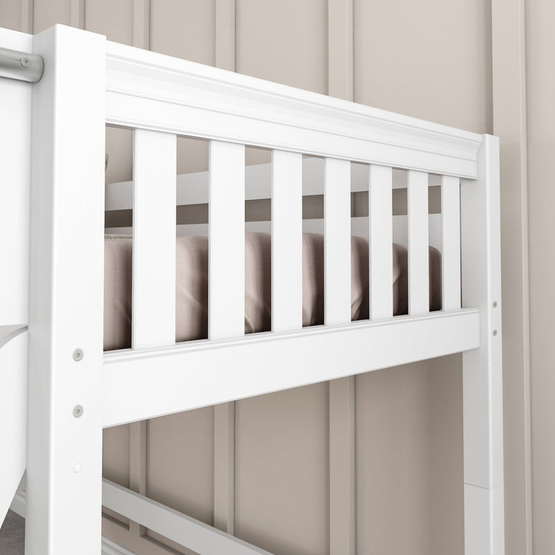Close-up of white baby crib railing with vertical slats, beige bedding and paneled nursery wall