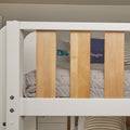 Close-up of a modern children's bunk bed with white painted frame, natural wood slats, gray quilt and striped pillow