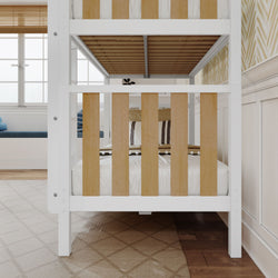 Modern wooden bunk bed in cozy bedroom with patterned rug and natural light from windows.