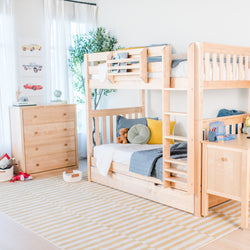 Bright airy kids' bedroom with natural wood twin-over-twin bunk bed with ladder and under-bed storage, striped rug, dresser, toys and modern children's room decor