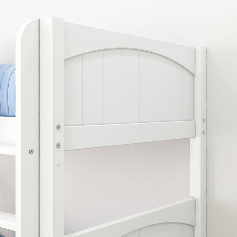 Close-up of white wooden bunk bed headboard and safety rail with arched panel design and blue mattress, modern farmhouse kids' bedroom furniture