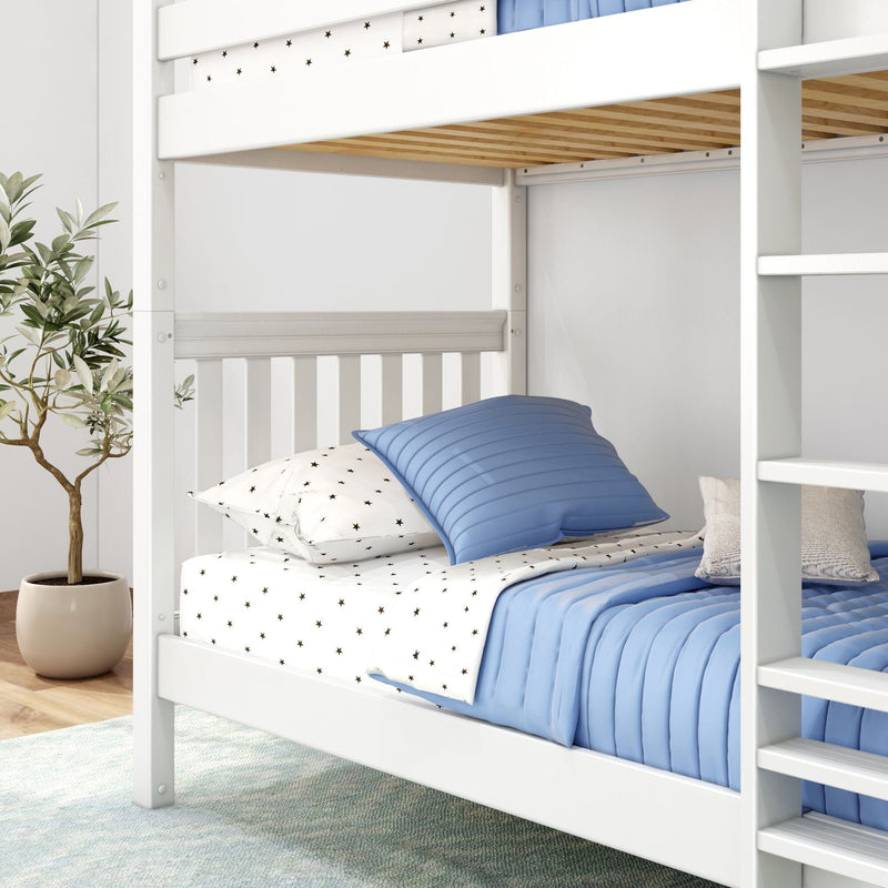 White wooden bunk bed with blue quilted bedding and star-patterned sheets in a bright kids' bedroom with ladder and potted plant
