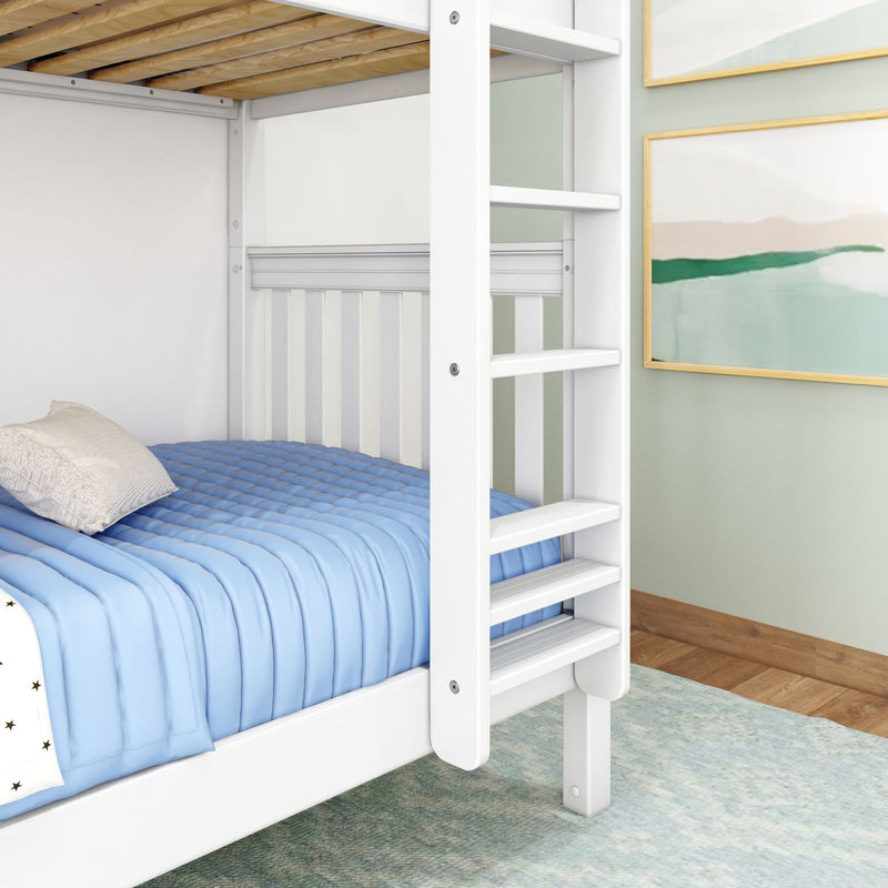 White wooden bunk bed ladder and lower bed with blue quilted comforter and beige pillow in a modern kids' bedroom with framed wall art and hardwood floor