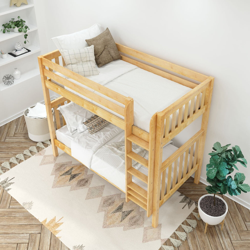 Light wood bunk bed with white bedding and neutral pillows in a minimalist children's bedroom with potted plant, shelving and patterned rug