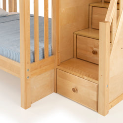 Light natural wood bunk bed with built-in storage stairs and pull-out drawer, blue fitted mattress, kids bedroom furniture