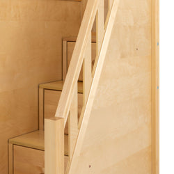 Light wood staircase with diagonal railing and built-in drawer storage, space-saving modern interior stairs ideal for small homes and lofts