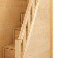 Close-up of a modern light birch plywood staircase with integrated storage drawers and minimalist wooden handrail