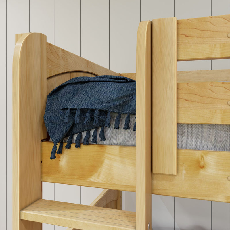 Solid pine loft bunk bed corner with built-in ladder, natural wood finish, gray mattress and navy blue textured fringed throw blanket in a modern kids' bedroom