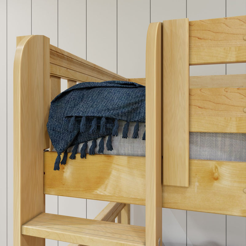 Solid pine bunk bed with natural wood finish, built-in ladder and blue fringed throw blanket in a bright contemporary bedroom