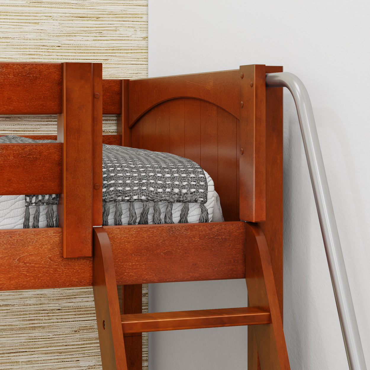 Wooden bunk bed corner with ladder and cozy gray blanket.