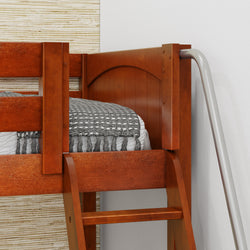 Wooden bunk bed corner with ladder and cozy gray blanket.