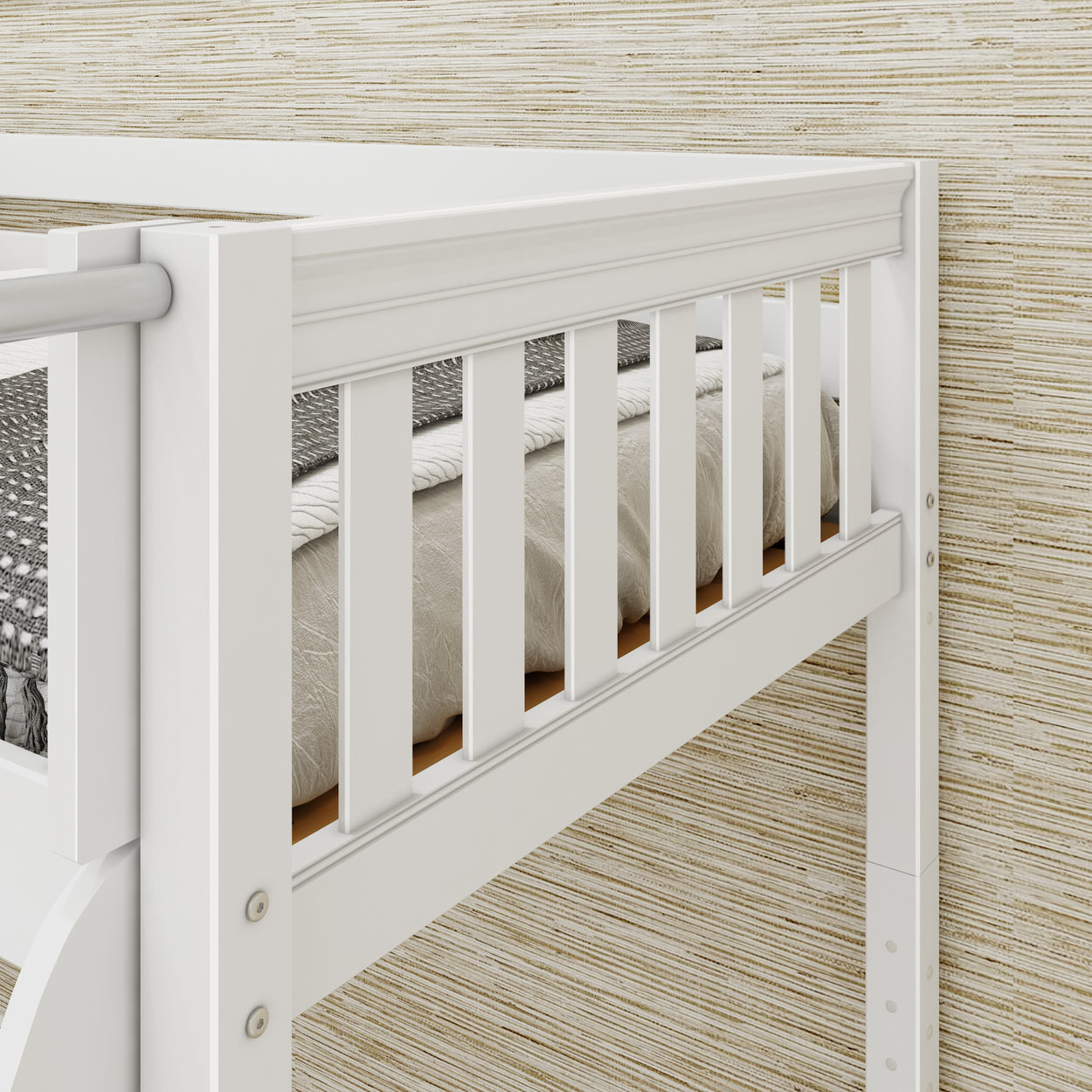 White bunk bed close-up with slatted design and cozy mattress against textured wall.