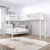 White wooden twin-over-twin loft bunk bed in bright modern kids' bedroom with ladder, neutral linens and geometric rug